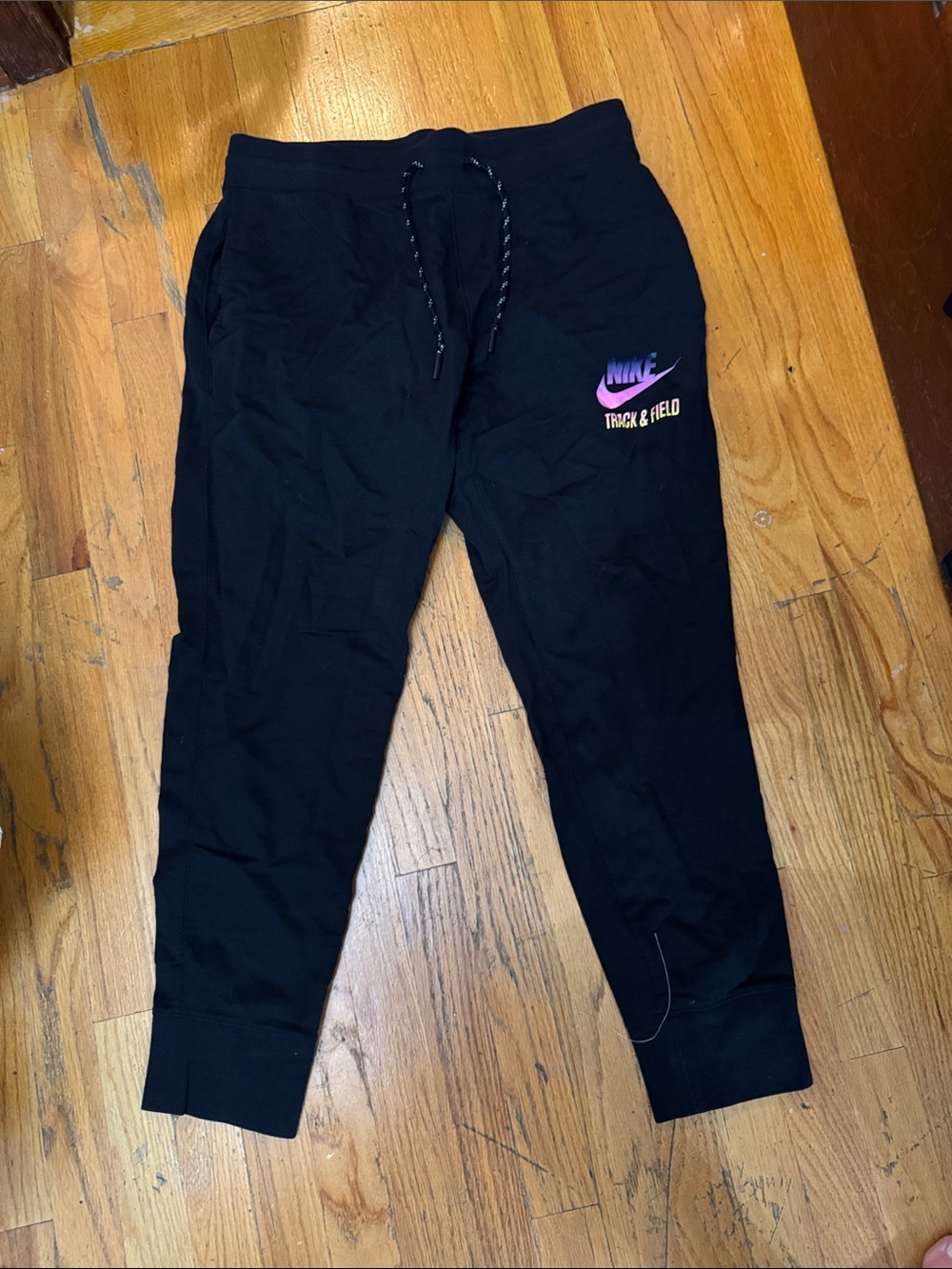Nike Woman’s Black Joggers with Pink Logo